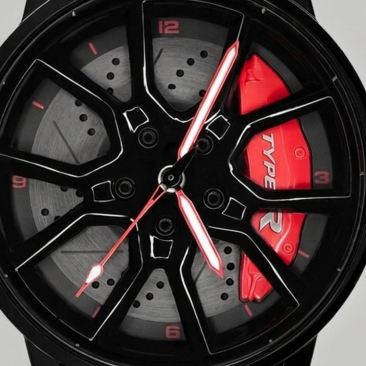 Primer plano de la llanta y de la pinza grabada TYPE R, reloj Honda Type R