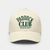 Vue de face d’une casquette beige Paddock Club Tourismo avec broderie verte